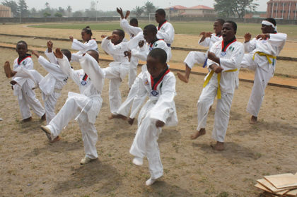 male students on the field for karate