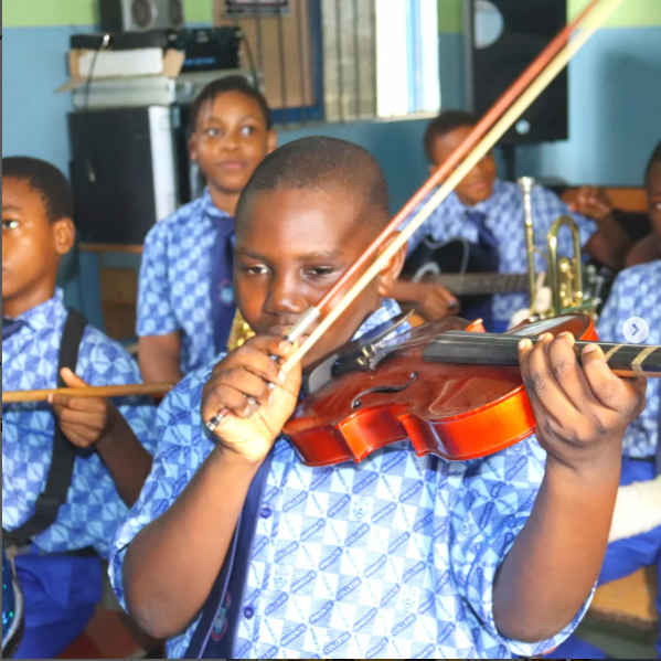 Junior boy playing violin